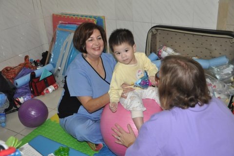 Carol and Cindy providing a TEAM developmental and speech assessment for this sweet little one.